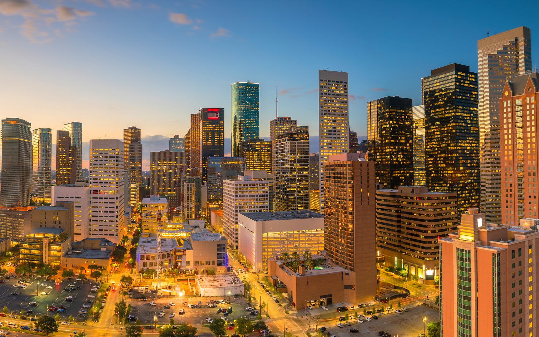 Panoramic view of the Houston, TX skyline at dusk.