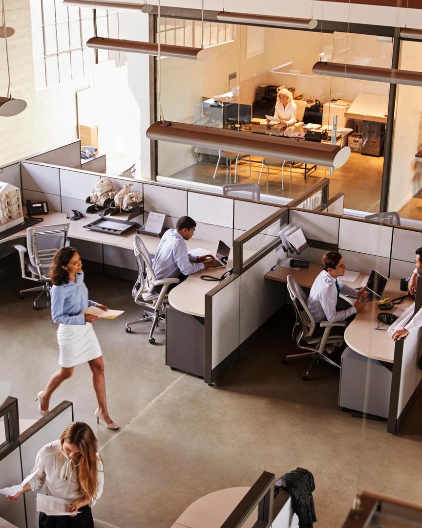 Elevated view of a busy office with cubicles.